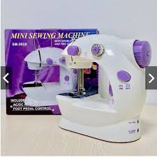 মিনি সেলাই মেশিন / Mini Sewing Machine 5 in 1 – Dual Speed Portable Mini Electric Pedal Double Threads Rewind Swing Machine
